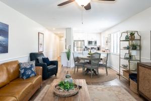 a living room with a couch and a table at 158 Beach Club Villa - Coastal Comfort with Stunning Marsh Views in Fripp Island
