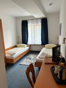 Ένα ή περισσότερα κρεβάτια σε δωμάτιο στο Gästezimmer im Trenner