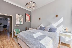 En eller flere senge i et værelse på KL-City - Terrasse & Barista