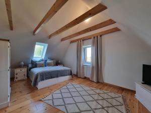 Postel nebo postele na pokoji v ubytování Ferienhaus in Ostseenähe auch mit Pferd