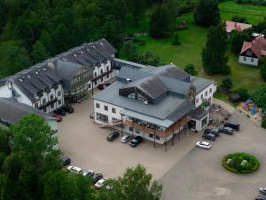 an aerial view of a large building with a parking lot at Hotel SPA Arkadia in Apšuciems