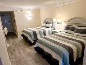 Postel nebo postele na pokoji v ubytování Daytona Beach Resort 1 bdrm family condo w/kitchen + 41 fotografií