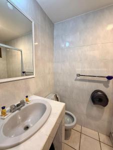 a bathroom with a sink and a toilet at Departamento Cielo in Puerto Vallarta