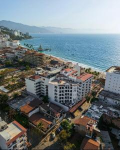 an aerial view of a city and the ocean at Departamento Cielo in Puerto Vallarta