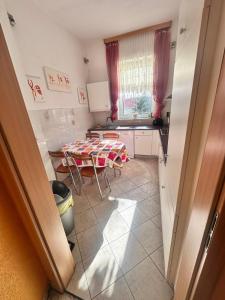 a kitchen with a table and chairs in a room at Ferienwohnung Warnemünde in Rostock