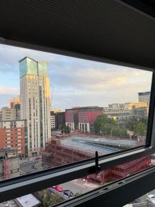a view of a city from a window at Birmingham City Centre-2 Mins to Station, City Views in Birmingham