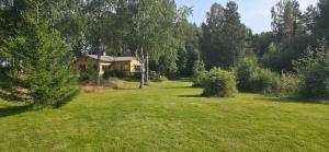 a house in the middle of a grass field at Merenkurkku in Molpe +19 photos