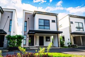 a house with white walls and windows at Maison Eden in Armenia
