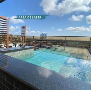 a swimming pool on the roof of a building at Reserva Madero 201 Vista Mar in Natal
