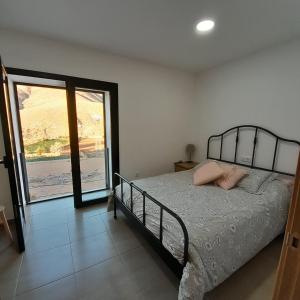 Ένα ή περισσότερα κρεβάτια σε δωμάτιο στο Casa Chano Brito