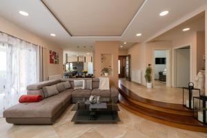 a large living room with a couch and a table at Villa Kadore in Višnjan