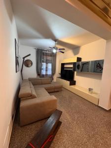 a living room with a couch and a tv at Sweet charm in Venice in Tessera