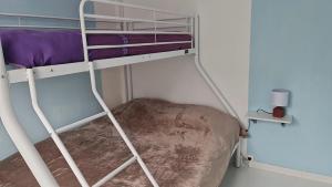 a bunk bed with a pillow in a room at Maison plein pied à Quend in Quend