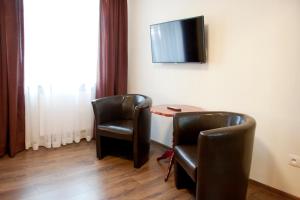 Telewizja i/lub zestaw kina domowego w obiekcie Apartamenty Hotelu Pod Orłem