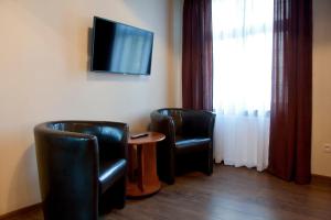 Telewizja i/lub zestaw kina domowego w obiekcie Apartamenty Hotelu Pod Orłem