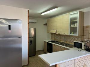 Kuchyň nebo kuchyňský kout v ubytování Villa Martina nel Salento