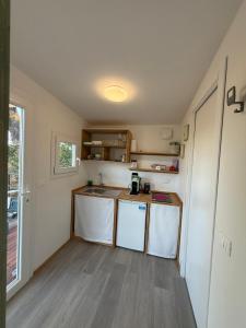 a small kitchen with a sink and a counter at Glamping La Piaggia in Poppi +9 photos
