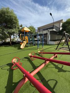 a playground with a slide and a swing at Luxurious and comfortable 1 level in Ensanche Savica de Mendoza +37 photos