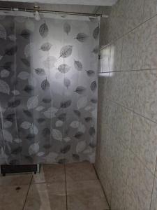 a shower with a wall covered in umbrellas at Lacaune Haus in São Francisco de Paula +14 photos