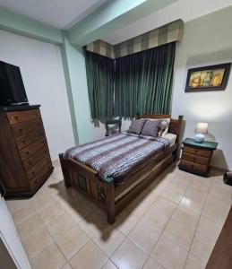 Кровать или кровати в номере Apartamento en Lecheria, Venecia