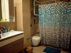 a bathroom with a shower with a toilet and a sink at Sousse appartement zone touristique in Sousse