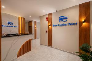 a hospital lobby with a sign for the clinic capital hotel at Giza Capital Hotel in Cairo