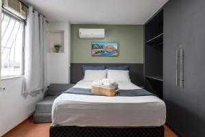 Ένα ή περισσότερα κρεβάτια σε δωμάτιο στο Apartamento especial- Icarai Niterói