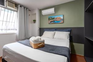 Ένα ή περισσότερα κρεβάτια σε δωμάτιο στο Apartamento especial- Icarai Niterói +25 φωτογραφίες