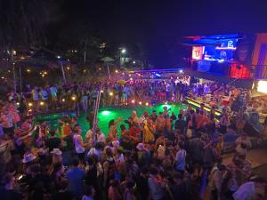 a crowd of people standing in front of a concert at WET Pool Party Haad Rin in Haad Rin