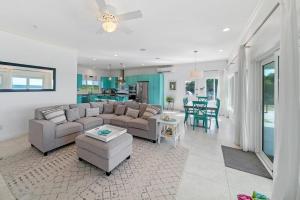 a living room with a couch and a table at Bella Mer home in Savannah Sound