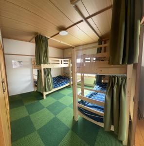 Ένα ή περισσότερα κρεβάτια σε δωμάτιο στο Minpaku Dorihu - Vacation STAY 19349