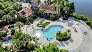 an aerial view of a house with a swimming pool at Vibrant 2br Apt Pool, Jacuzzi, Gym #11 in Tampa