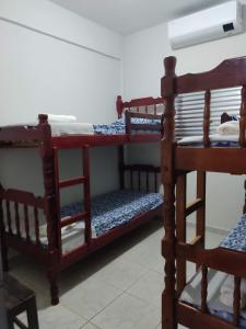 Ένα ή περισσότερα κρεβάτια σε δωμάτιο στο Residencial Franco Casa 06