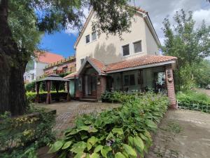 a house with a brick driveway in front of it at Single-family villa in Sun Island Scenic Area in Harbin