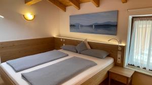 Postel nebo postele na pokoji v ubytování Ferienwohnung Anneliese
