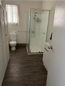 a bathroom with a shower and a toilet at Dylans Accommodation Sea Lake in Sea Lake