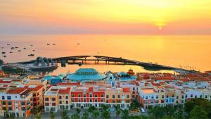 an aerial view of a city at sunset at LABE Hotel Phu Quoc in Phú Quốc