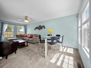 a living room with a table and chairs and a couch at Freedom's Stay at Liberty Hills in Jacksonville