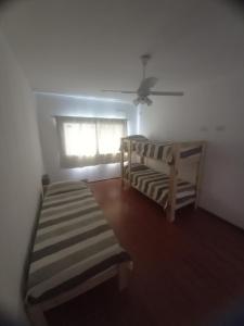 Ένα ή περισσότερα κρεβάτια σε δωμάτιο στο Casa Funes Town