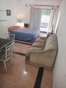 En eller flere senge i et værelse på Departamento cerca de todo + 8 billeder