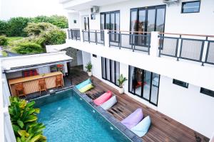 an aerial view of a building with a swimming pool at Serenity Uluwatu in Uluwatu +12 photos