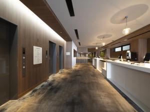 a hallway of a hospital with a long wooden floor at Hotel Oriental Express Fukuoka Nakasu Kawabata in Fukuoka +72 photos