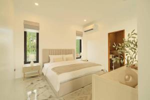 En eller flere senge i et værelse på Green Valley Golf Club Villa 66 + 57 billeder