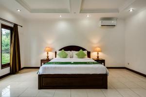 Ένα ή περισσότερα κρεβάτια σε δωμάτιο στο Gracia Apartment Seminyak Managed by Manara +18 φωτογραφίες