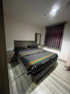 Ένα ή περισσότερα κρεβάτια σε δωμάτιο στο Wellcotel Apartemen