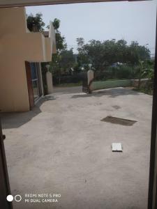 a piece of paper on the ground in a parking lot at Royal Residency in Mahabalipuram