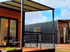 a pergola on the deck of a house at BIG4 Stratford Caravan Park in Stratford