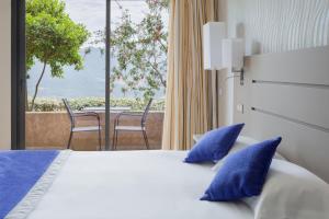 Postel nebo postele na pokoji v ubytování Best Western Plus San Damianu