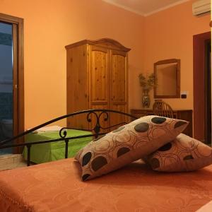 a bedroom with a bed with two pillows on it at La Perla del Sannio in Sant'Agata de' Goti
