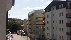 a view of a building from a balcony at Apartman Strezoski in Ohrid